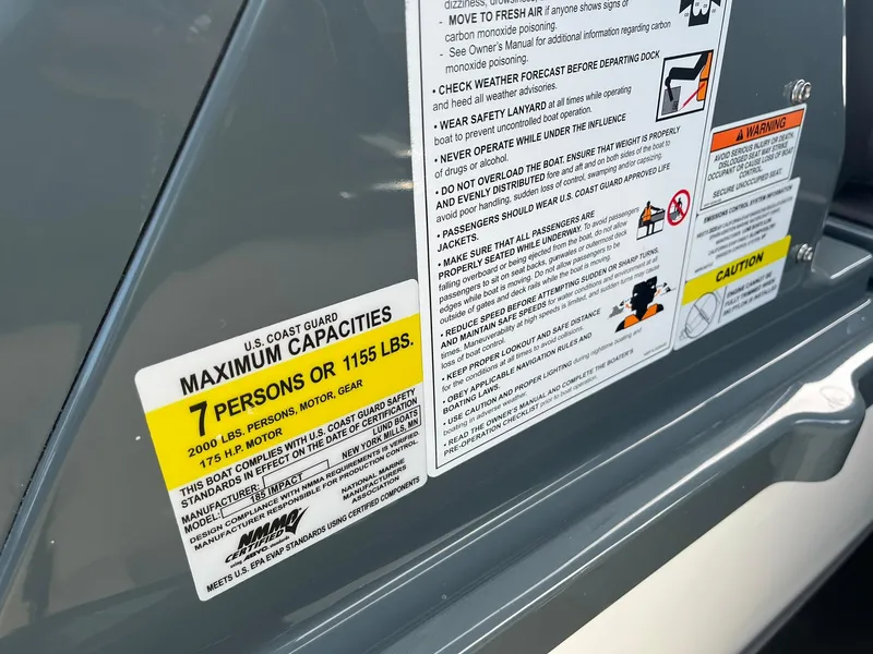 Slide: The Image of 2025 Lund 185 Impact GL boat capacity label, maximum 7 persons or 1155 lbs. - 37