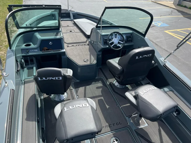 Slide: The Image of 2025 Lund 185 Impact GL boat interior with seating and steering console. - 5