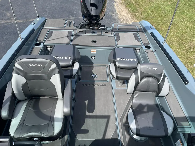 Slide: The Image of 2025 Lund 185 Impact GL boat interior with four cushioned seats and sleek design. - 6
