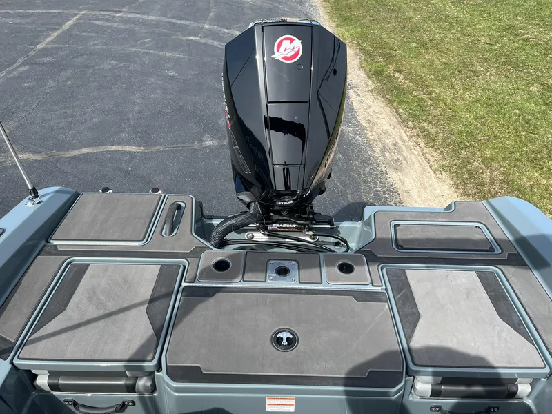 Slide: The Image of 2025 Lund 185 Impact GL boat with sleek motor and spacious deck design. - 9