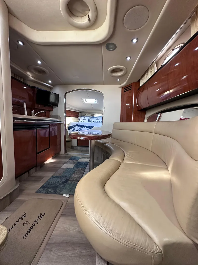 Slide: The Image of Luxurious interior of 2004 Sea Ray 360 Sundancer yacht with plush seating and modern amenities. - 20