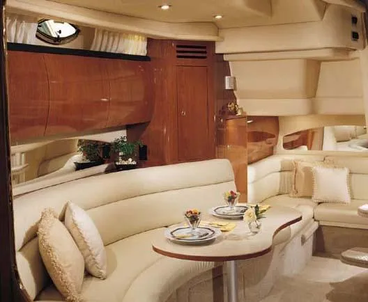 Slide: The Image of Luxurious interior of 2004 Sea Ray 360 Sundancer yacht with elegant seating and dining area. - 27