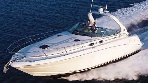 Slide: The Image of 2004 Sea Ray 360 Sundancer cruising on open water. - 29