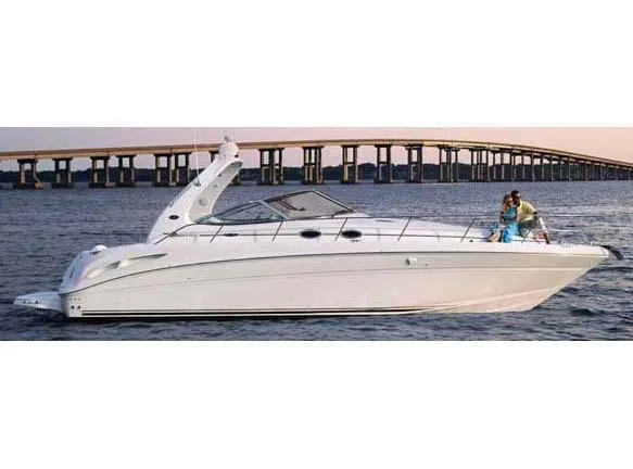 Slide: The Image of 2004 Sea Ray 360 Sundancer yacht cruising near a bridge. - 30