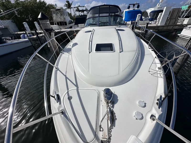 Slide: The Image of 2004 Sea Ray 360 Sundancer yacht docked at marina, front deck view. - 7