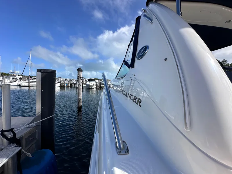 Slide: The Image of Sea Ray 360 Sundancer 2004 docked at marina under blue sky. - 8