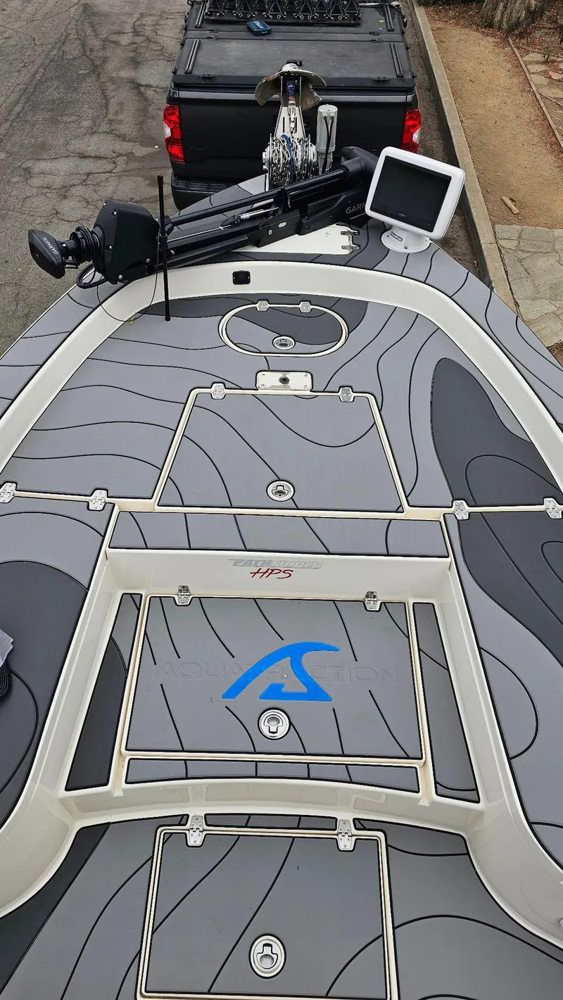 Slide: The Image of 2014 Pathfinder 2600 HPS boat with sleek design and advanced navigation equipment. - 5