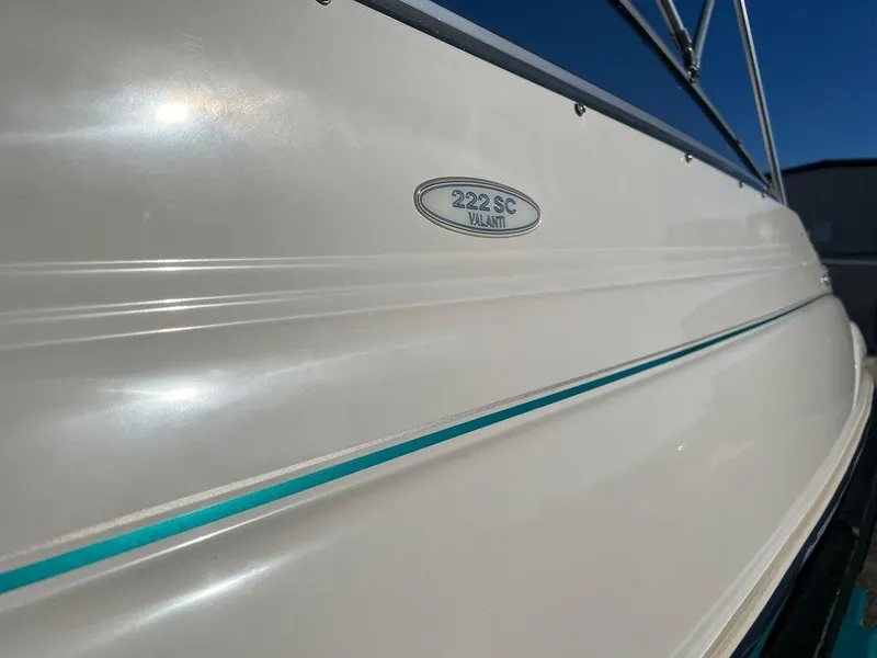 Slide: The Image of 1995 Regal Valanti 222 boat side view with model emblem. - 11