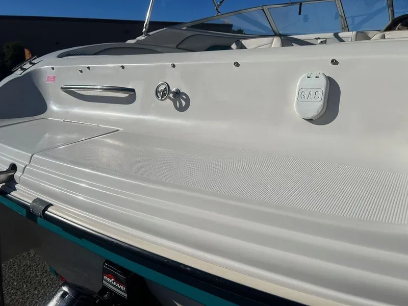 Slide: The Image of 1995 Regal Valanti 222 boat, white exterior, gas cap visible, sleek design. - 16