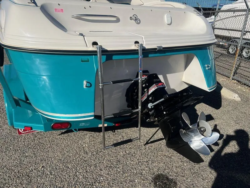 Slide: The Image of 1995 Regal Valanti 222 boat stern with outboard motor and ladder. - 17