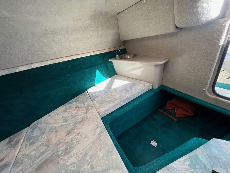 Slide: The Image of Interior cabin of 1995 Regal Valanti 222 boat with seating and sink. - 26