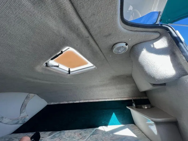Slide: The Image of Interior cabin of 1995 Regal Valanti 222 boat with skylight and seating area. - 27