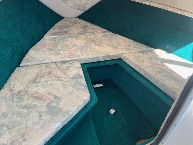 Slide: The Image of Interior cabin of 1995 Regal Valanti 222 boat with cushioned seating. - 28