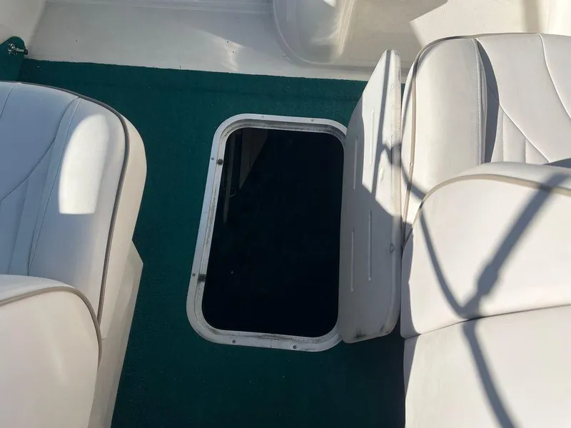 Slide: The Image of Open hatch on 1995 Regal Valanti 222 boat with white seating. - 29