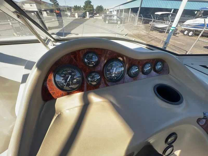 Slide: The Image of Dashboard of a 1995 Regal Valanti 222 boat with gauges and controls. - 32