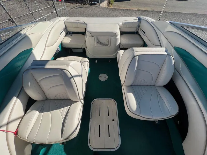 Slide: The Image of 1995 Regal Valanti 222 boat interior with white leather seats and green carpet. - 41