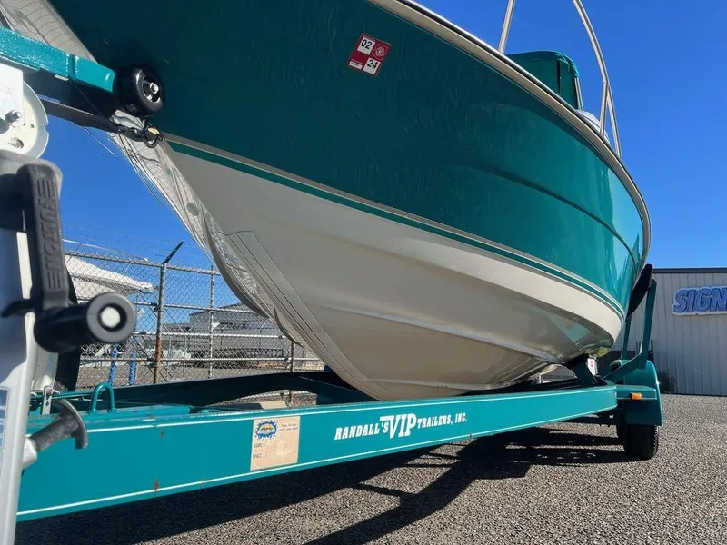 Slide: The Image of 1995 Regal Valanti 222 boat on a Randall VIP trailer, parked outdoors. - 8