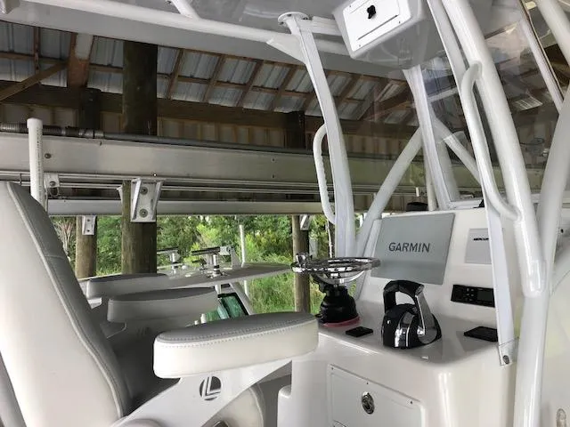 Slide: The Image of 2021 ZCB 2600 Freemason CC boat interior with Garmin navigation system. - 10
