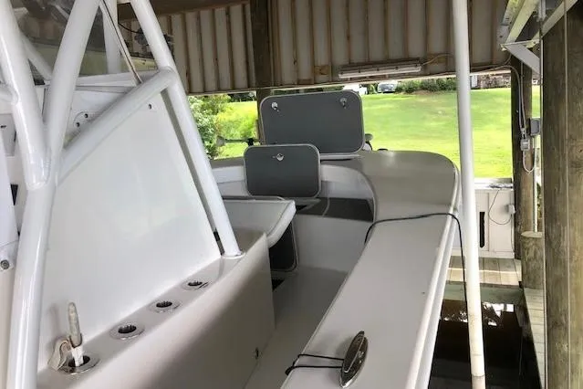 Slide: The Image of 2021 ZCB 2600 Freemason CC boat interior under a covered dock. - 11