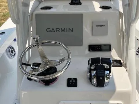Slide: The Image of 2021 ZCB 2600 Freemason CC boat console with Garmin navigation and Mercury controls. - 13