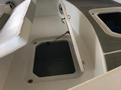 Slide: The Image of Open storage compartment in 2021 ZCB 2600 Freemason CC boat interior. - 7