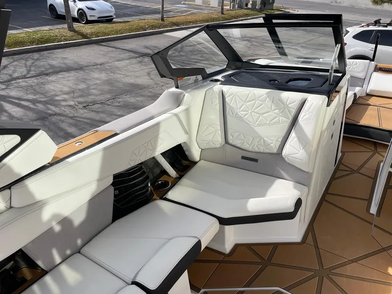 Slide: The Image of 2024 Nautique Super Air Nautique G25 Paragon interior with luxurious white seating. - 10