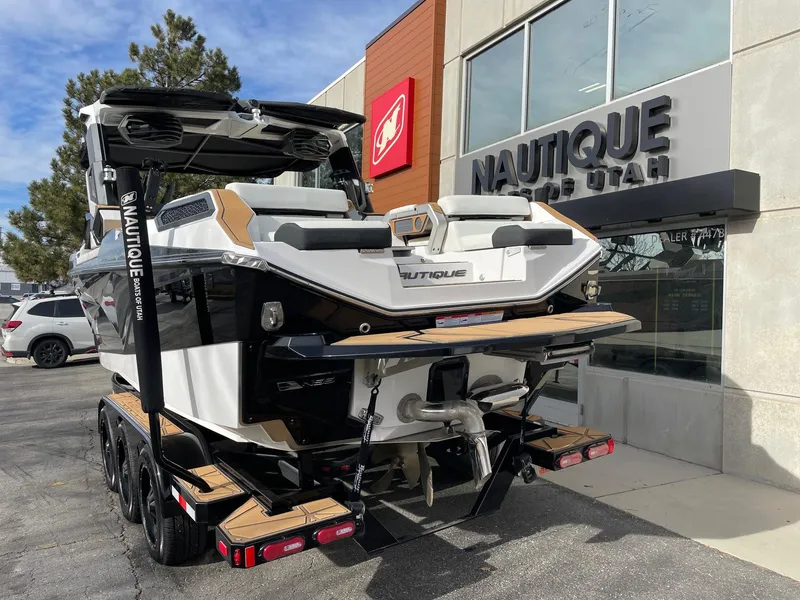 Slide: The Image of 2024 Nautique Super Air Nautique G25 Paragon boat at dealership, rear view. - 3