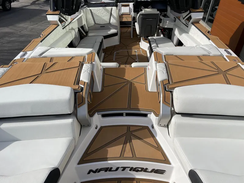 Slide: The Image of 2024 Nautique Super Air Nautique G25 Paragon interior with luxurious seating and modern design. - 4