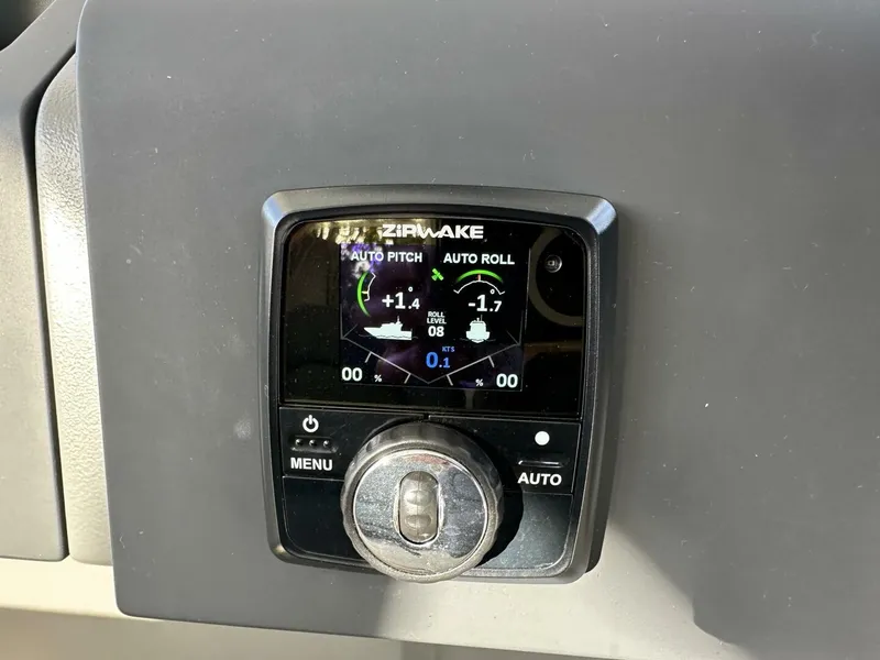 Slide: The Image of Nimbus T-11 2022 control panel with Zipwake auto pitch and roll display. - 14
