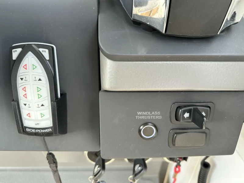 Slide: The Image of Control panel of a 2022 Nimbus T-11 with Side-Power remote and windlass thrusters. - 15