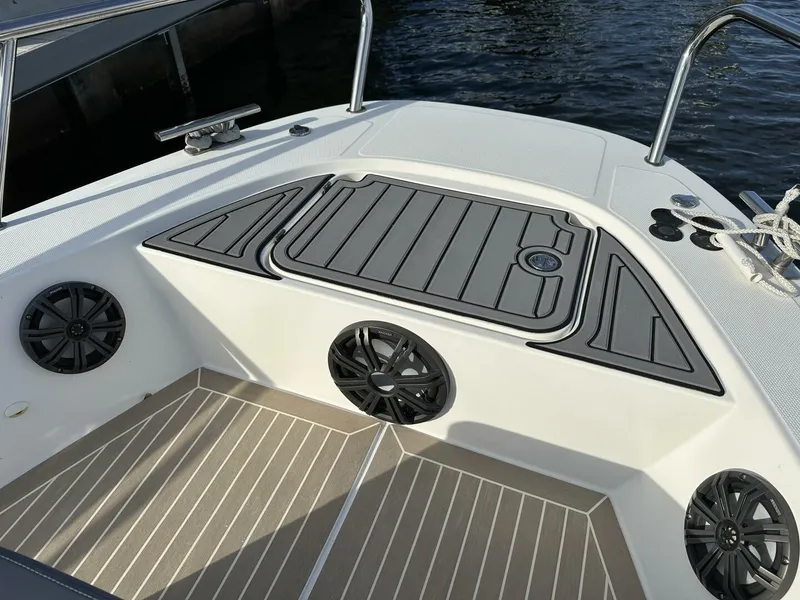 Slide: The Image of Nimbus T-11 2022 boat deck with speakers and storage compartments. - 8