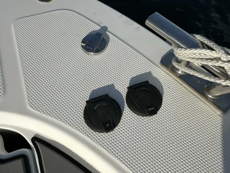 Slide: The Image of Nimbus T-11 boat deck controls, 2022 model, featuring trim tabs and cleat. - 9