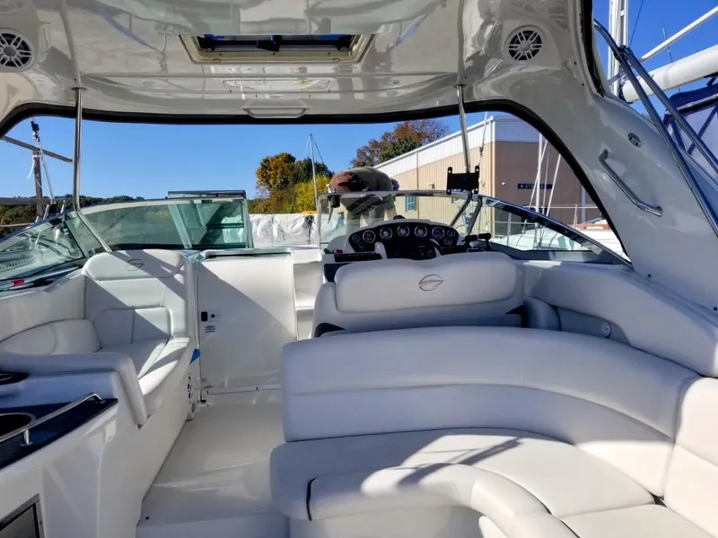 Slide: The Image of Interior of 2007 Crownline 340 CR boat with white seating and dashboard. - 11