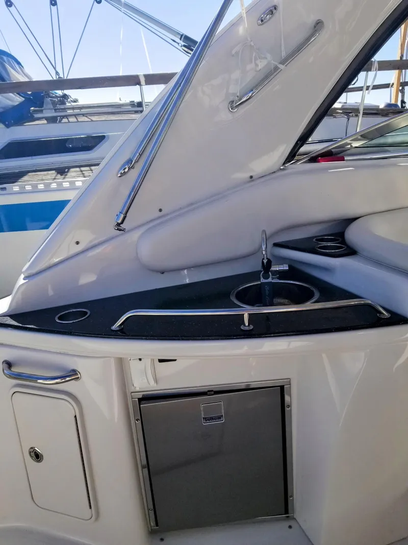 Slide: The Image of 2007 Crownline 340 CR yacht interior with sink and storage area. - 12