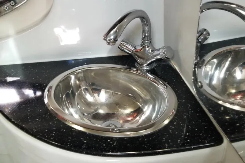 Slide: The Image of Stainless steel sink with chrome faucet in 2007 Crownline 340 CR boat. - 13