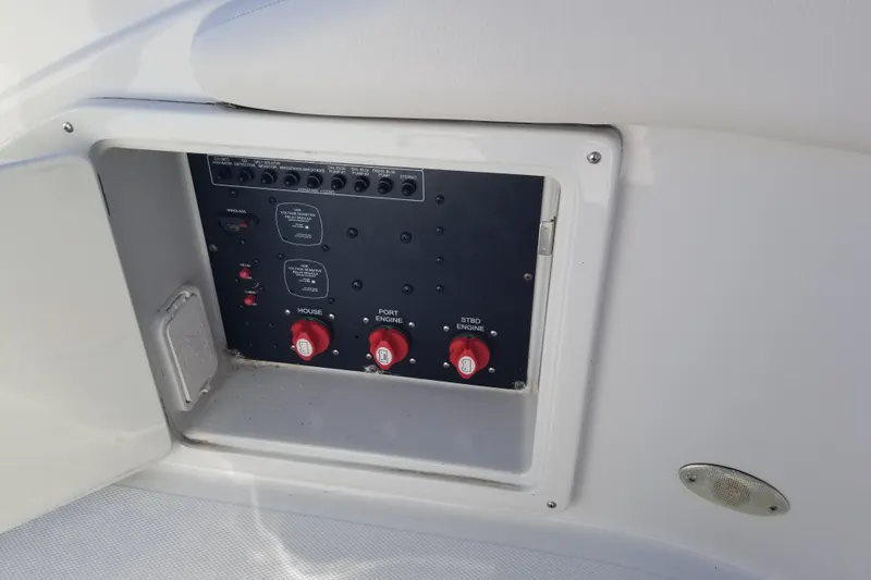 Slide: The Image of Control panel of 2007 Crownline 340 CR boat with switches and dials. - 14