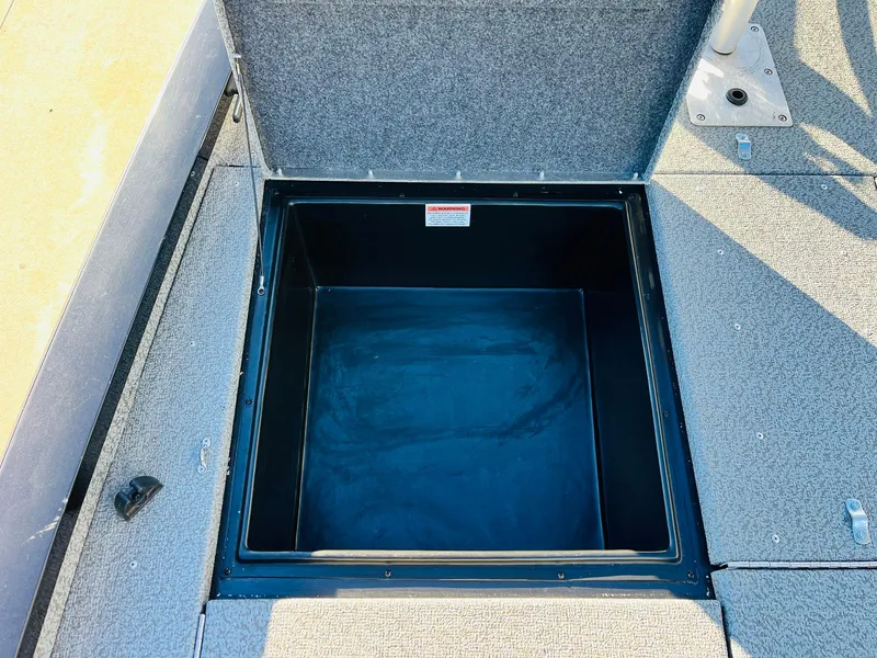 Slide: The Image of Open storage compartment on 2020 G3 Sportsman 1910 boat. - 16