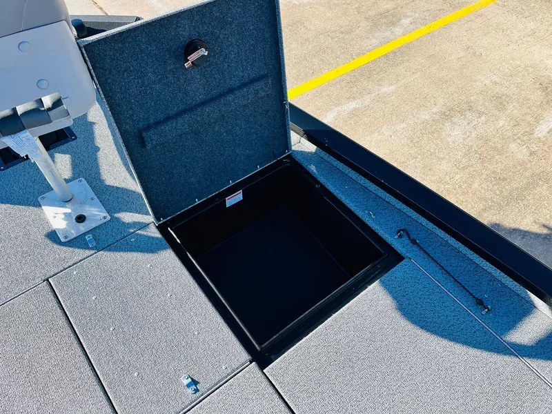 Slide: The Image of Open storage compartment on 2020 G3 Sportsman 1910 boat deck. - 19