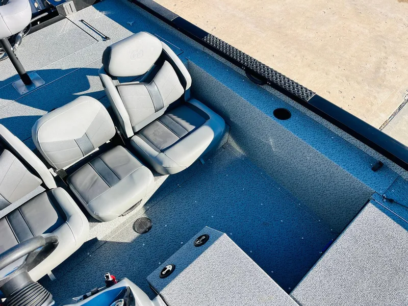 Slide: The Image of 2020 G3 Sportsman 1910 boat interior with gray seating and steering console. - 26