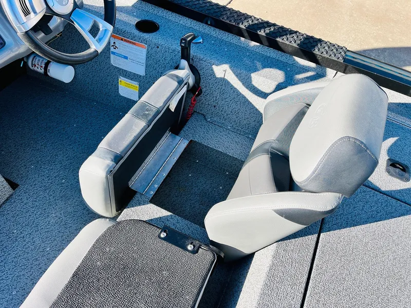 Slide: The Image of Interior of 2020 G3 Sportsman 1910 boat with gray seating and steering wheel. - 31