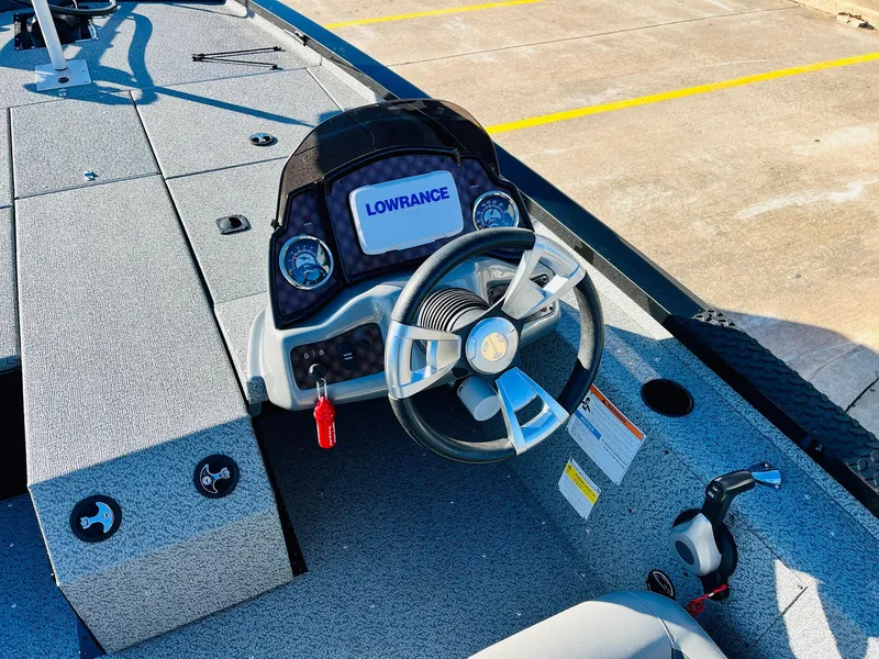 Slide: The Image of 2020 G3 Sportsman 1910 boat dashboard with Lowrance electronics and steering wheel. - 32