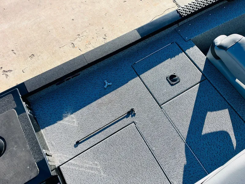 Slide: The Image of 2020 G3 Sportsman 1910 boat interior with storage compartments and seating. - 38