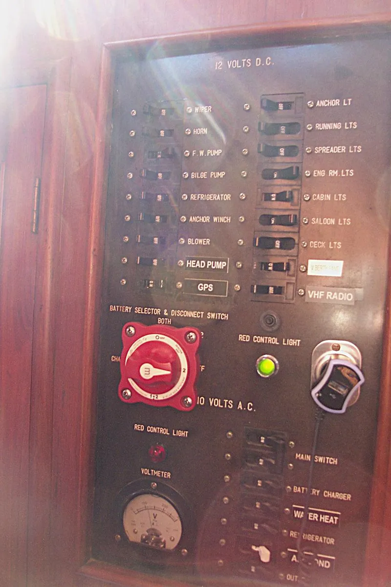 Slide: The Image of Control panel of 1983 Marine Trader 34 Trawler with various switches and indicators. - 33