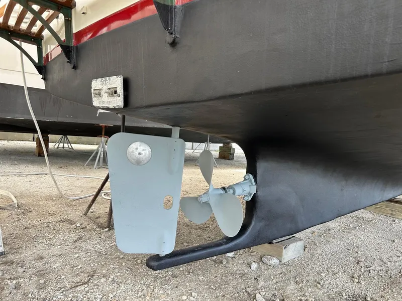 Slide: The Image of 1983 Marine Trader 34 Trawler propeller and rudder on dry dock. - 35