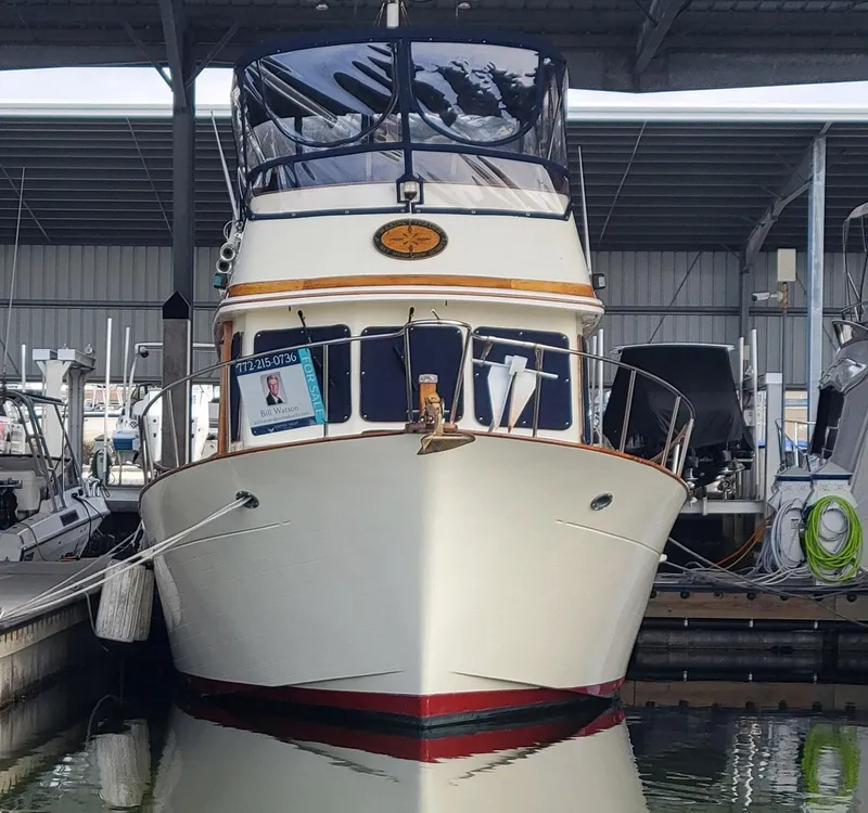 Slide: The Image of 1983 Marine Trader 34 Trawler docked in a marina. - 39