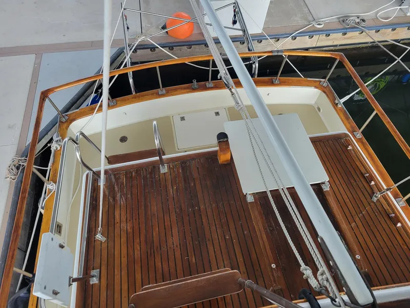 Slide: The Image of 1983 Marine Trader 34 Trawler with wooden deck, docked at marina. - 7