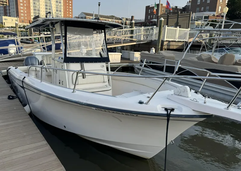 Slide: The Image of 2004 Grady-White Release 283 boat docked at marina, side view. - 3