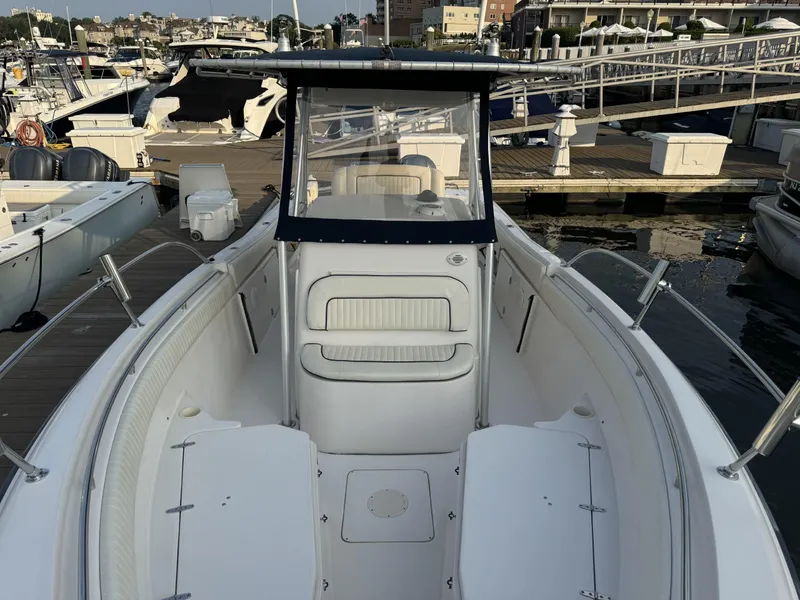 Slide: The Image of 2004 Grady-White Release 283 boat docked at marina, front view. - 9