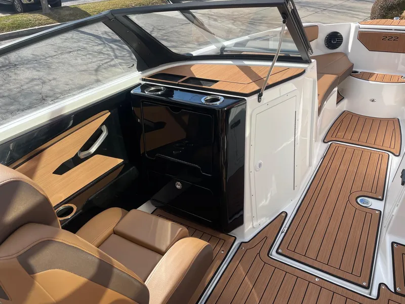 Slide: The Image of 2025 Yamaha Boats 222SD interior with sleek design and wood accents. - 10