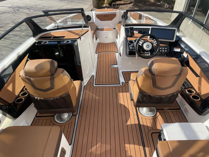 Slide: The Image of 2025 Yamaha Boats 222SD interior with luxurious seating and modern dashboard design. - 5